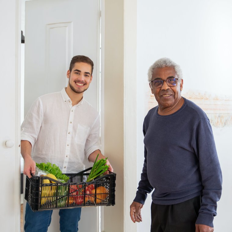 A caregiver arriving at an older man's home